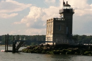 A handsome granite light marks the entrance to Huntington Harbor on Long Island's north shore.