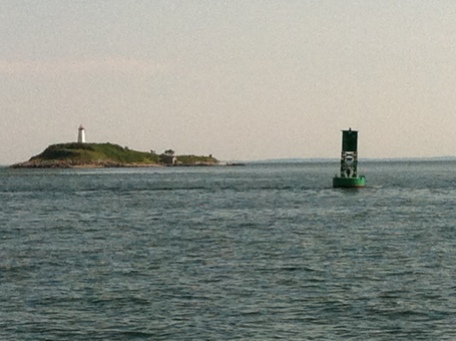 Even on a calm day, the current's enough to set the buoy to listing off Fisher Island.